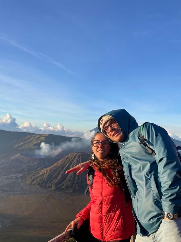 Guests watching sunrise from King Kong Hill viewpoint with Mount Bromo in the background