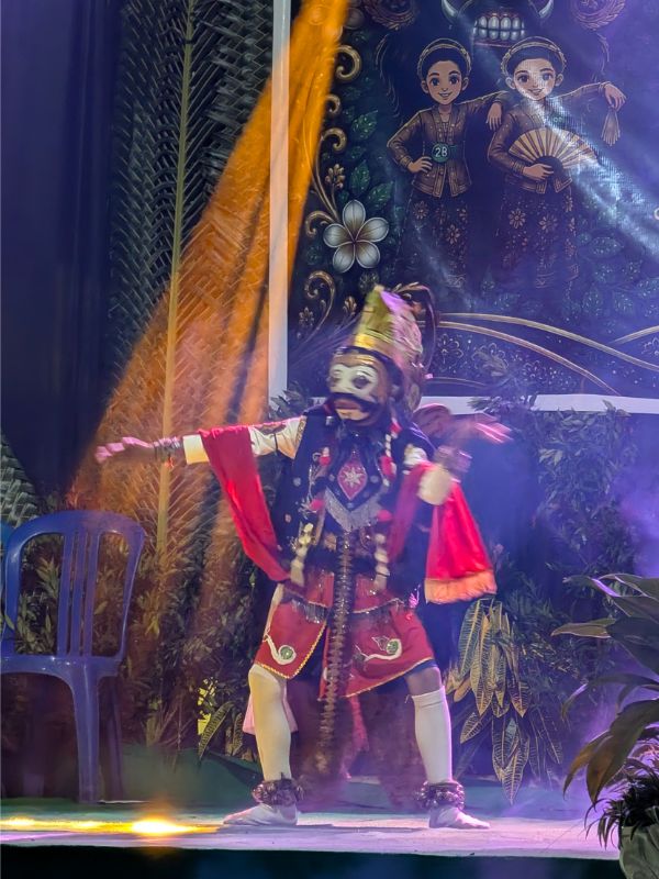 traditional East Javanese dancer performing in full costume during a cultural experience