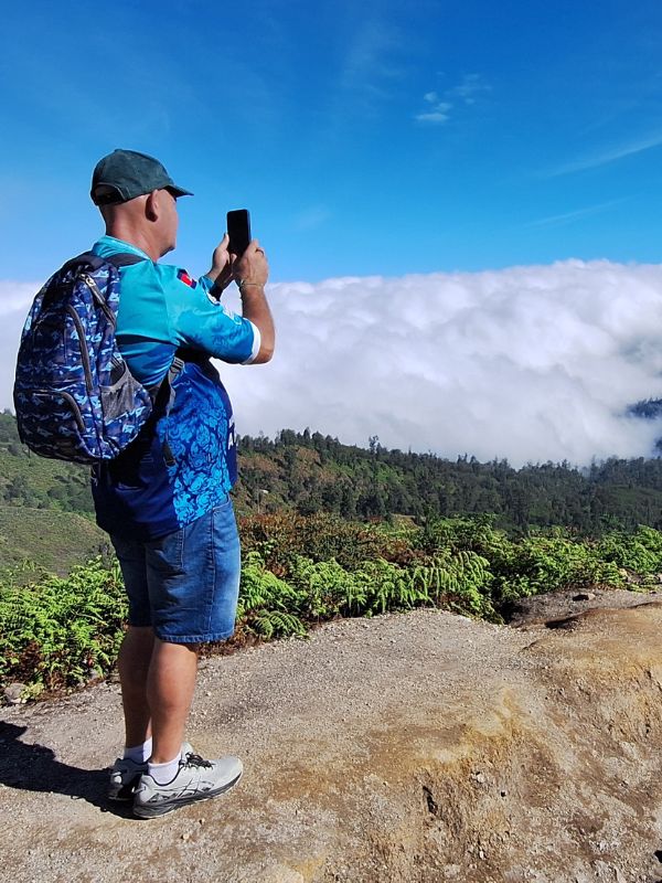 East Java Tours guest above the clouds at Mount Ijen