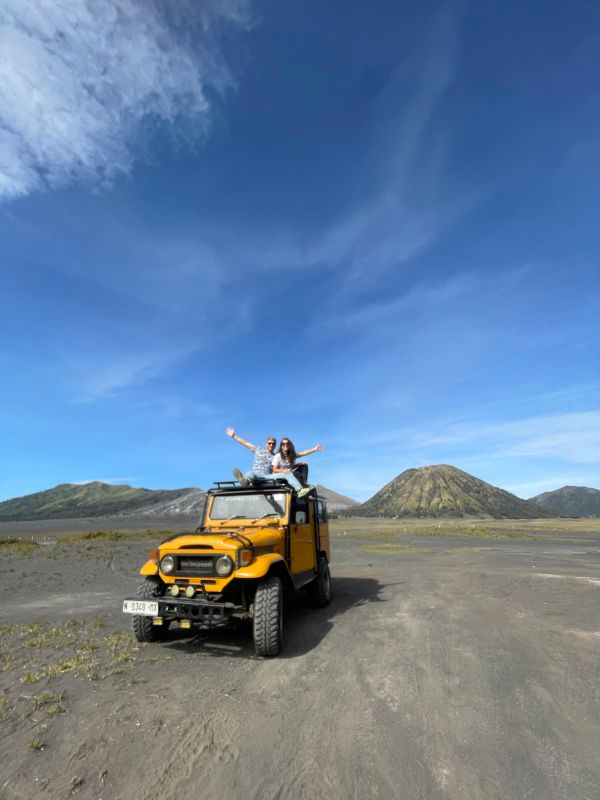 Guests sitting on a jeep in the Mount Bromo Sea of Sand in East Java